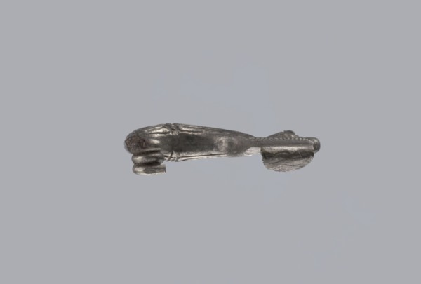 Snake-headed fibula, Southern Italian workshop. Fibula with an arched, thick hoop terminated on one