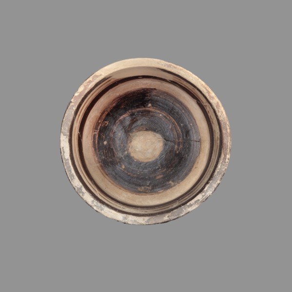 Pyxis with a duck motif. Vessel of yellowish clay with brown matte paint and brown varnish; flat