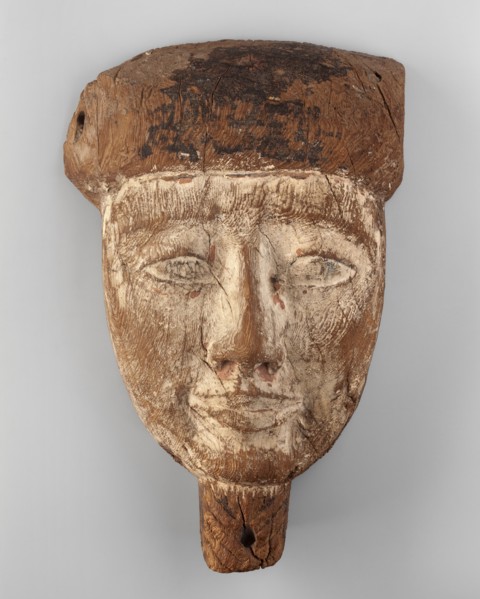 Sarcophagus mask of a deceased man. Creamy, elongated face, almond-shaped eyes, long straight nose.