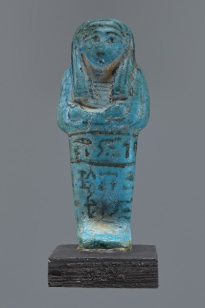 Ushabti Cha-em-uase. A mummy-shaped figurine shabti made of faience and pressed into a mold.
