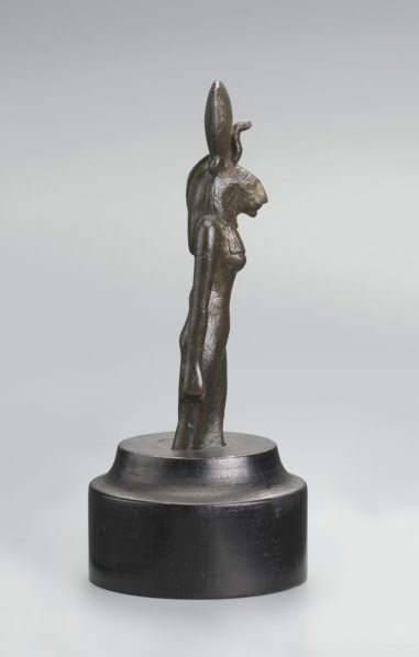Sekhmet figurine, lion-headed goddess shown standing or walking with a lioness head in a tripartite
