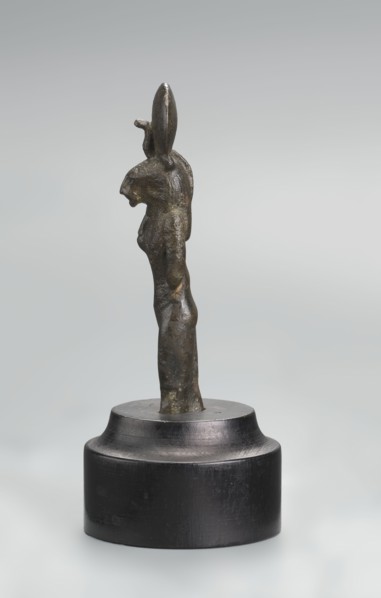 Sekhmet figurine, lion-headed goddess shown standing or walking. Lioness head with a tripartite wig