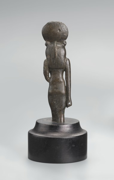 Sekhmet figurine, lion-headed goddess shown standing or walking; lioness head with tripartite wig