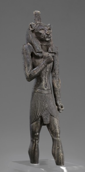 Figurine of the god Mahes. Figurine of a striding man with a lion's head. The lion's head is set