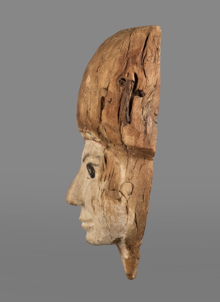 Sarcophagus mask with fragment of a high wig above the forehead, decorated on the edge of the