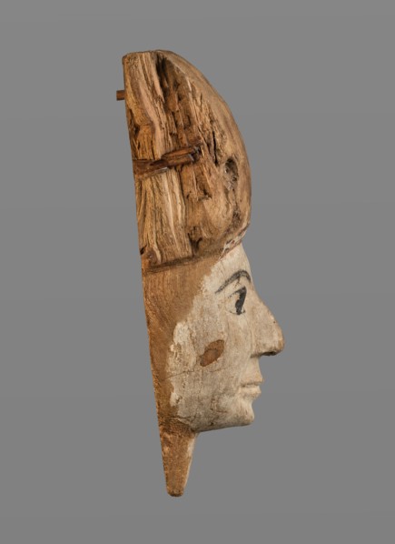 Sarcophagus mask with fragment of a high wig above the forehead, decorated on the edge of the