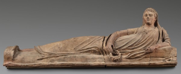 Sarcophagus lid, The deceased is depicted in a semi-reclining position, resting his left forearm on