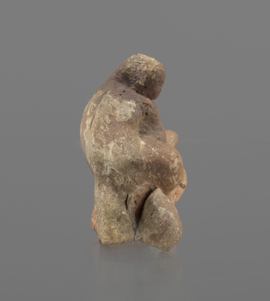 Terracotta figurine of Silenus, Silenus mythology, terracotta. Figurine of an obese Silenus sitting