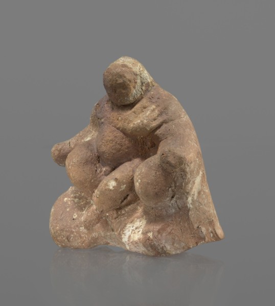 Terracotta figurine of Silenus, Silenus mythology, terracotta. Figurine of an obese Silenus sitting