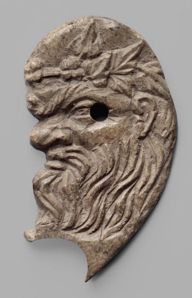 Decoration in the shape of the head of Silenus. Relief appliqué of the head of Silenus, depicted in