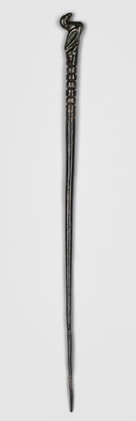 Pin, unknown Luristan workshop. Pin with a thin, oval shaft terminating in a head in the form of a