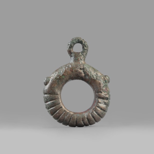 Decorative pendant from a horse harness, unknown Near Eastern workshop. The pendant is in the form