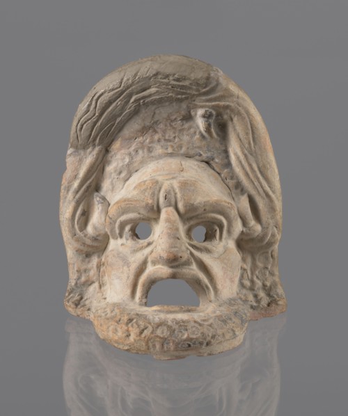 Tragic mask, terracotta, tragic masks, theater masks. Tragic mask depicting a male face. Likely a