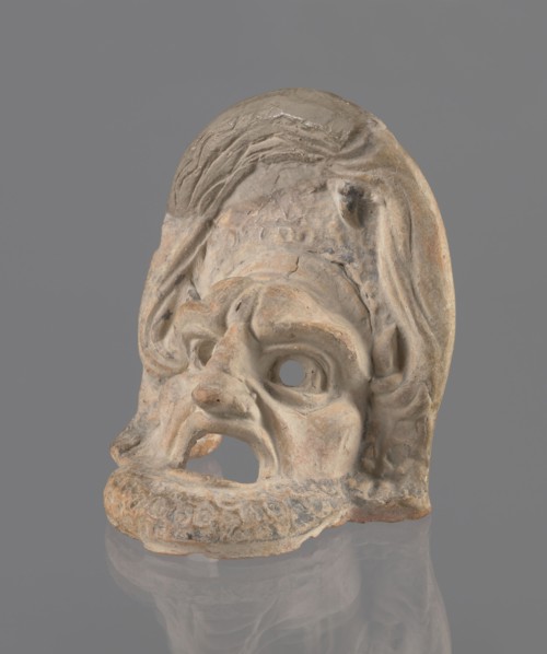 Tragic mask, terracotta, tragic/theater mask. Tragic mask depicting a male face, likely a