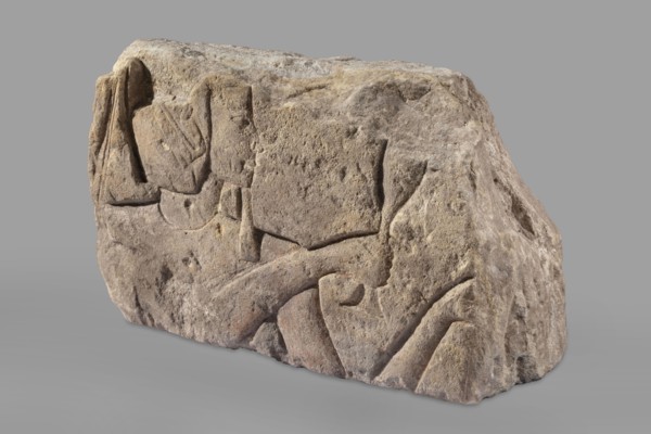 Relief depicting Ramesses II with a ritual vessel, uraeus iconographic, ibes wig iconographic,