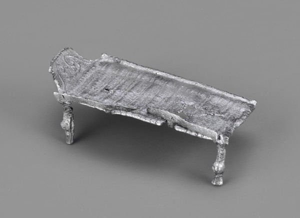 Miniature bed, votive offering or model of furniture; rests on four legs formed from square bars