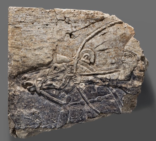Fragment of an orthostat with relief decoration, unknown Neo-Assyrian workshop. Fragment of a stone