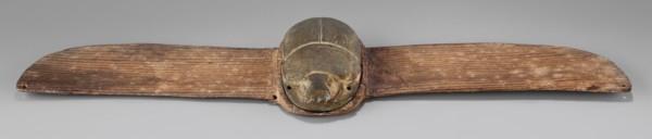 Winged scarab; protective amulet used with mummies and as grave goods; sacred animal motif; scarab