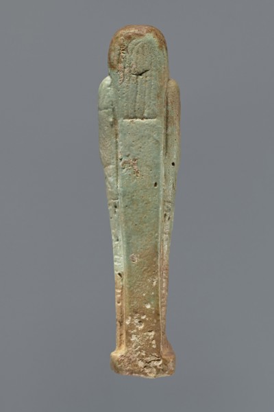 Ushabti, Mummy-shaped figurine, standing on a base, supported by a pillar/pilaster at the back.