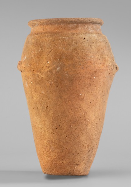 Vessel with wavy handles. Vessel with an elongated belly that widens towards the top. Short,