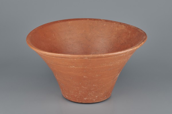 Deep, cup-shaped clay bowl with a slightly convex bottom and sides arching upwards; straight, flat,