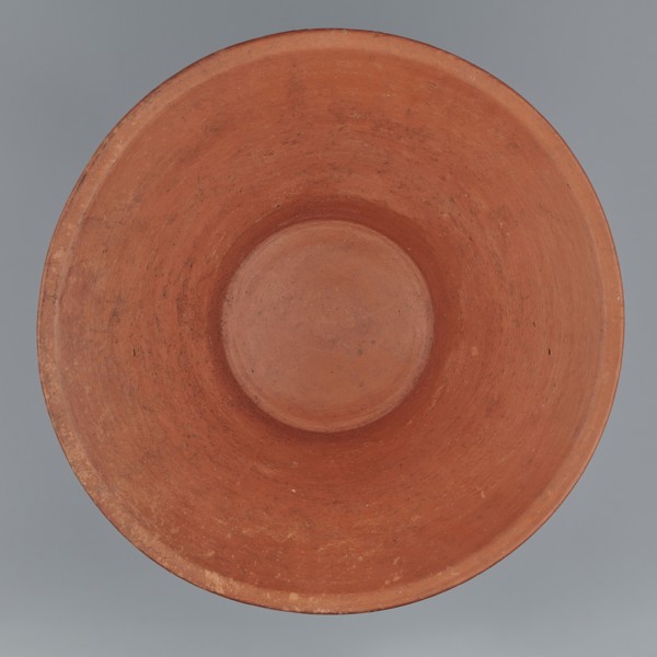 Deep bowl. Cup-shaped clay bowl with slightly convex bottom and sides arching upwards, straight