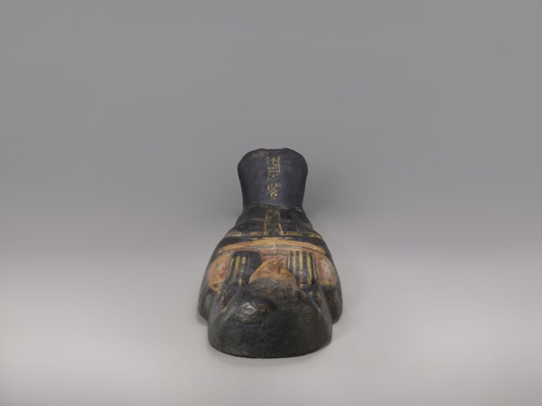 Lid of an anthropoid sarcophagus of a woman with clearly modeled legs. The head is sculpturally