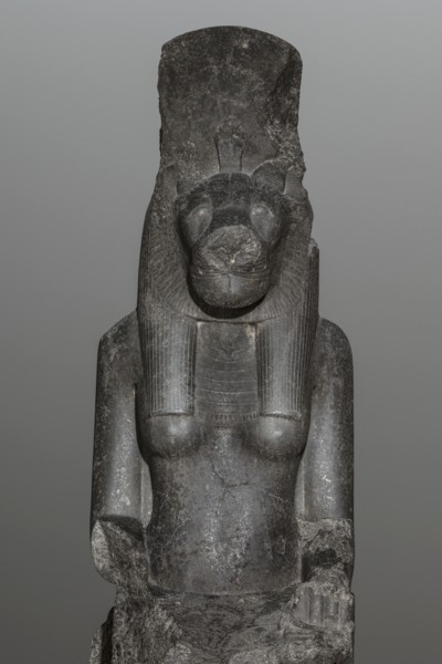 Statue of the goddess Sekhmet. Woman with a lioness's head seated on a throne, dressed in a long,