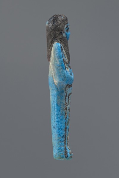Ushabti Henut-netjeru, Henut-netjeru private name. Mummy-shaped figurine; shabti. Arms crossed on