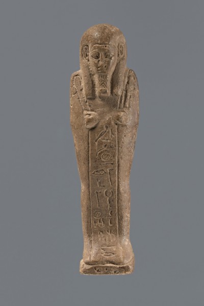 Ushabti, Mummy-shaped figurine, standing on a base with a pilaster at the back. Arms crossed on the