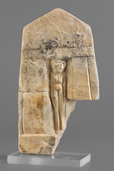 Naos stele with a female figure, small naos-shaped stele slightly tapered at the top and