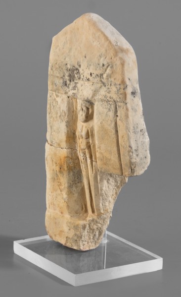 Naos stele with a female figure; small naos-shaped stele, slightly tapered at the top and