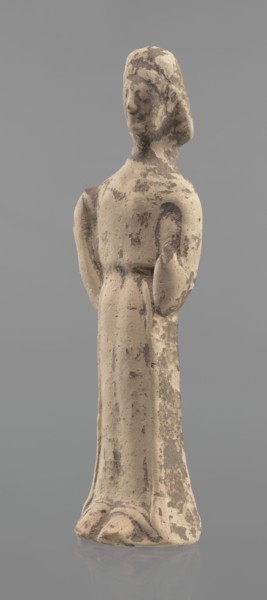 Terracotta figurine of a woman, unknown Boeotian workshop. Female mold-pressed terracotta figurine.