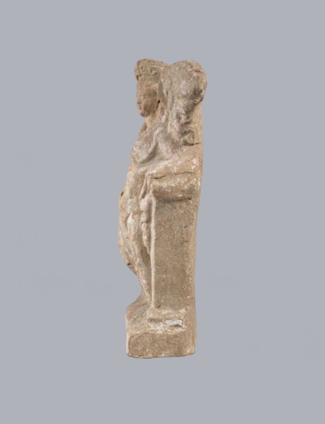 Terracotta figurine of Eros with a goose. Terracotta; figurine of a standing Eros produced from a