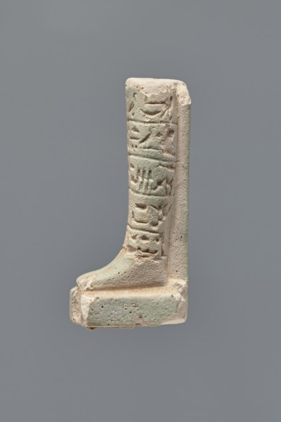 Ushabti - fragment. Mummy-shaped figurine, fragment of the legs preserved from the knees down. On