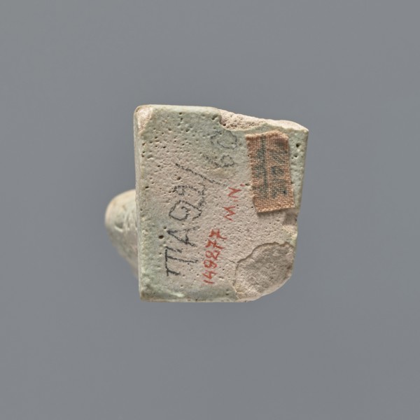 Ushabti fragment, mummy-shaped figurine; fragment of the legs preserved from the knees down. On the