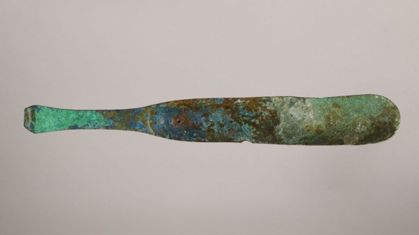 Scraper, metal scraper with a typical slightly curved shape consisting of a handle and a blade with