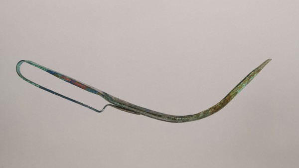 Scraper, metal scraper with a typical, slightly curved shape consisting of a handle and a blade