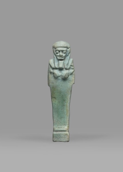 Ushabti, Mummy-shaped funerary figurine shabti, standing on a base, back supported by a