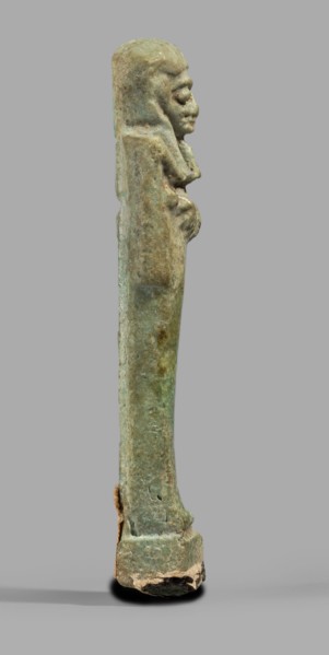Ushabti, Mummy-shaped funerary figurine standing on a base, back supported by a pillar/pilaster.