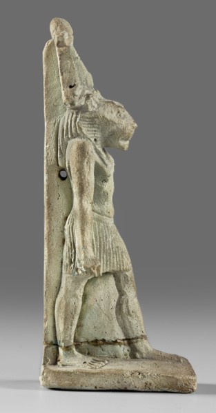 Amulet - god Mahes; figurine of a striding lion-headed male deity wearing an atef crown, dressed in