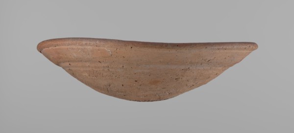 Bowl. Shallow bowl of rounded, asymmetrical shape with a rounded, flaring, irregular rim. Surface