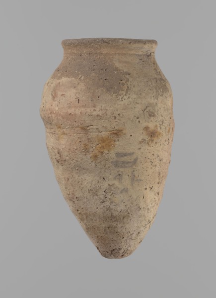 Vessel with hieratic inscription. Conical clay vessel tapering toward the bottom, irregular, widest