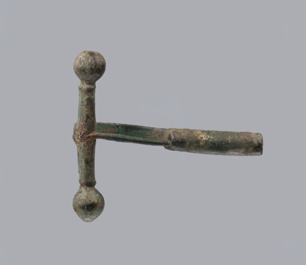 Onion-shaped fibula, Italy. Bronze fibula with hinged structure: an arched ring made from a
