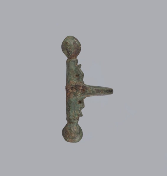 Onion-shaped fibula, Italy. A fibula with a hinged structure featuring an arched ring formed from a