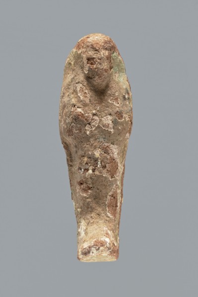 Ushabti. A mummy-shaped ushabti figurine made of clay, impressed in a mold. Traces of white primer