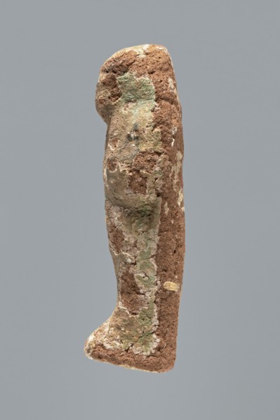 Ushabti. A mummy-shaped ushabti figurine made of clay, impressed in a mold. Traces of white primer