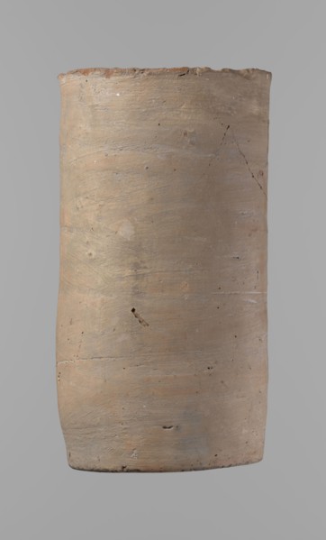 Canopic urn. Clay canopic urn with a cylindrical shape and a flat bottom and a flat, straight rim.