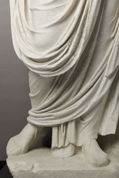 Roman statue, unknown Roman workshop. The figure of a standing man dressed in a tunic and toga,