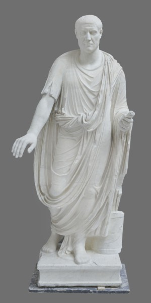 Roman statue, unknown Roman workshop. Figure of a striding man dressed in a tunic and toga. The